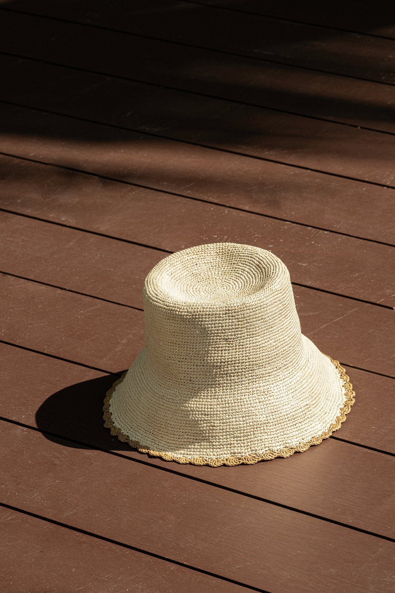 Sierra bucket hat in yellow — handwoven toquilla straw with a golden scalloped trim